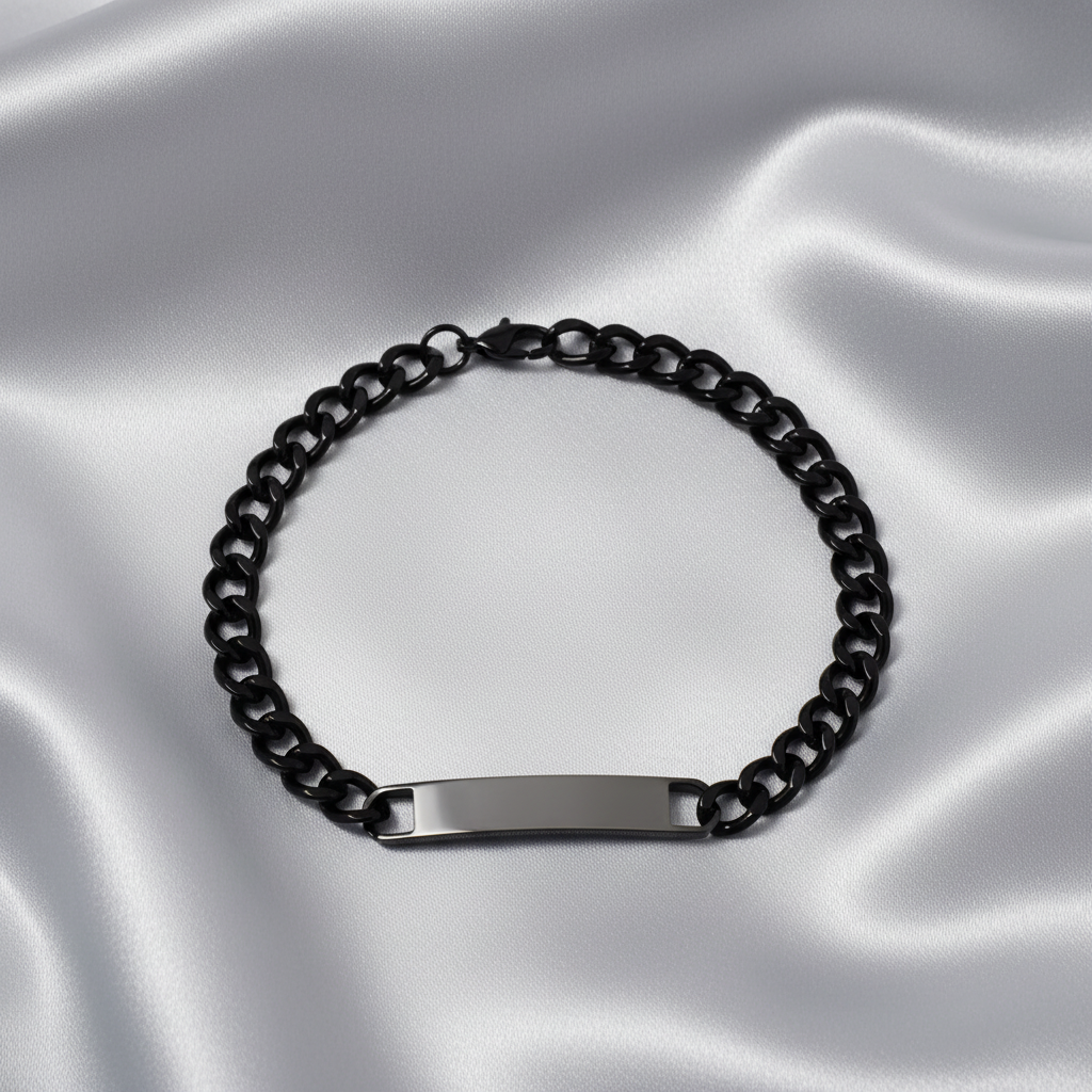 Black chain bracelet with a silver tag on a light gray background